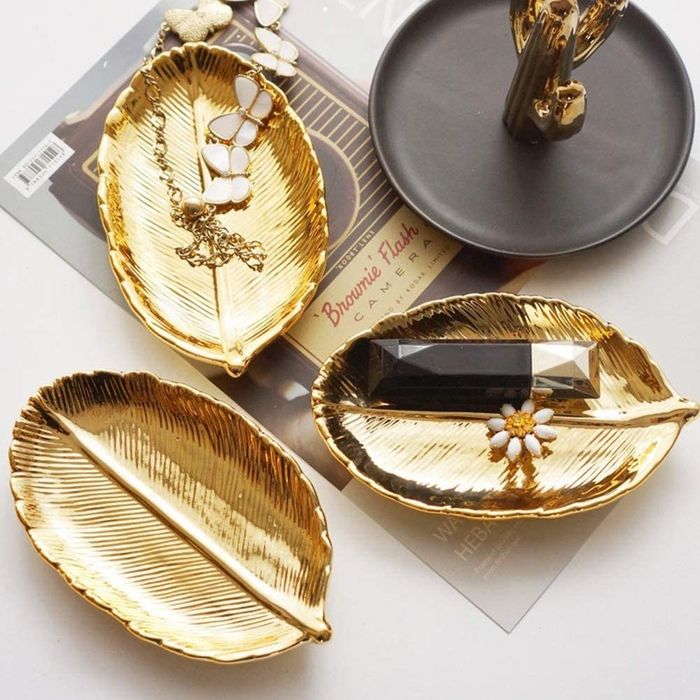 The gold leaf-shaped tray, showcasing its luxurious design and practicality.