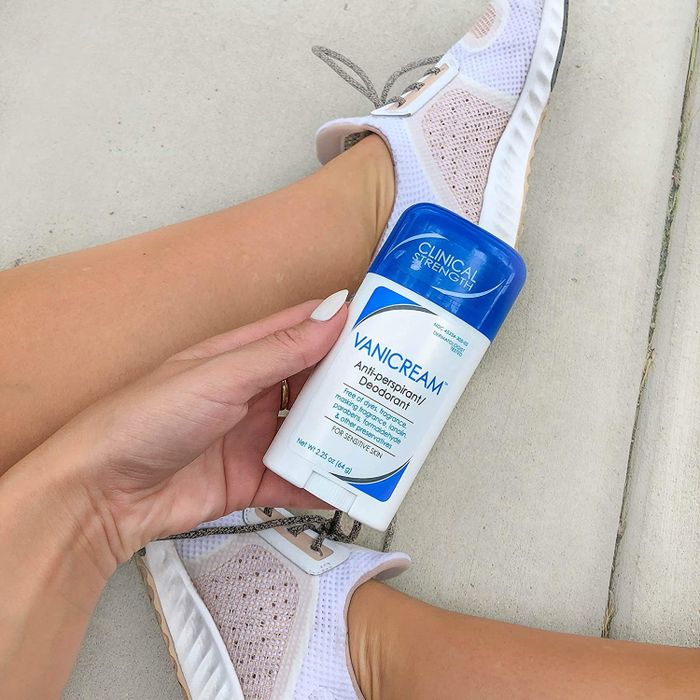 A hand holding the Vanicream anti-perspirant deodorant.