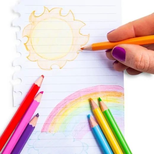 Colored pencils being used to create artwork