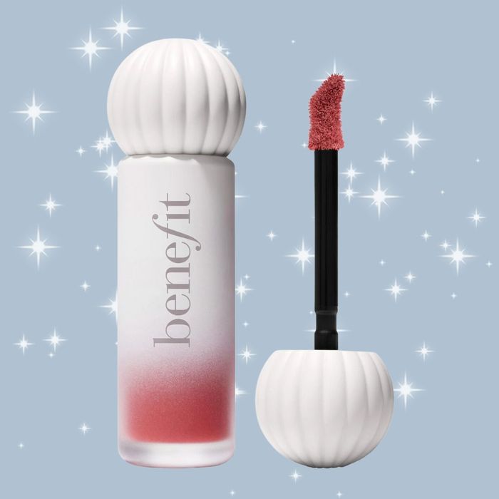 Benefit Cosmetics Lip Tint bottle and applicator, set against a sparkling background