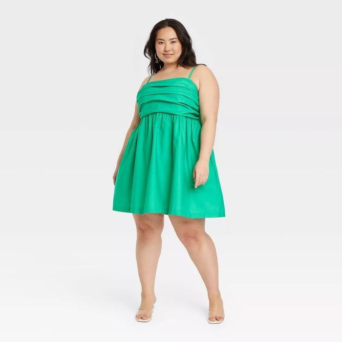 A model wearing the dress in green