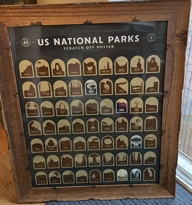 A customer review photo of their framed scratch-off poster