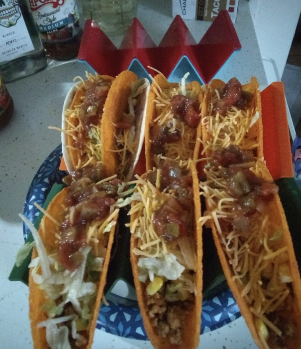 reviewer photos showing tacos securely placed in the holders