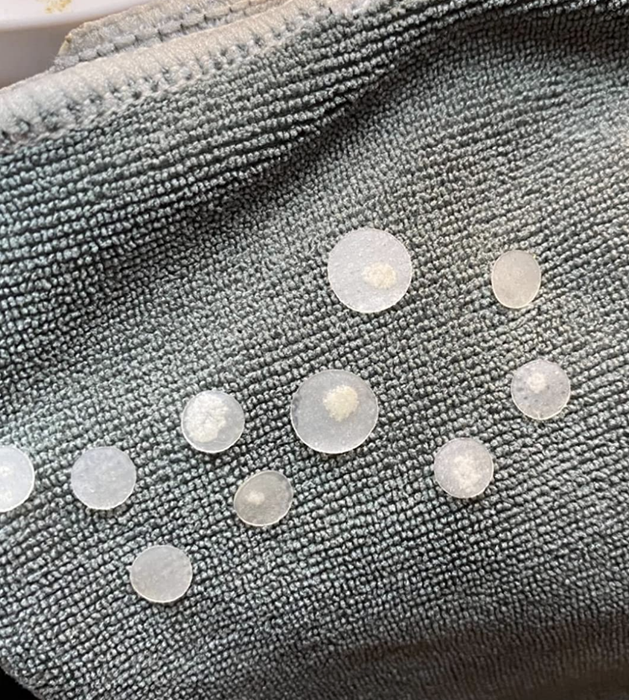 Images from a reviewer showcasing the application and results of the pimple patches.