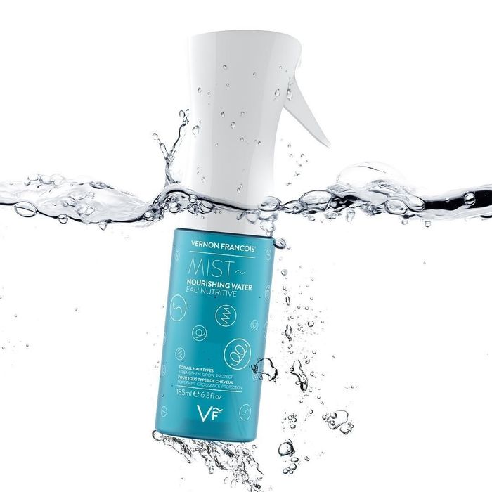 A mist spray bottle filled with water for an easy spritz on your hair.