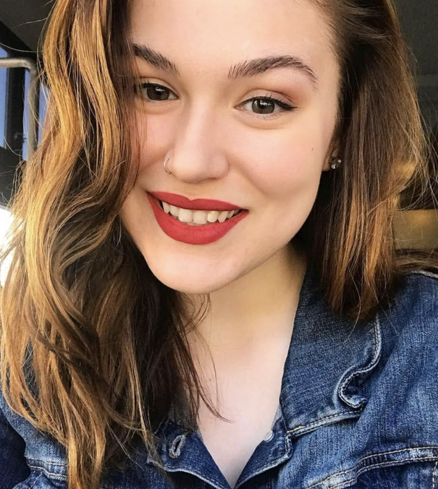 reviewer showcasing the brow gel in use