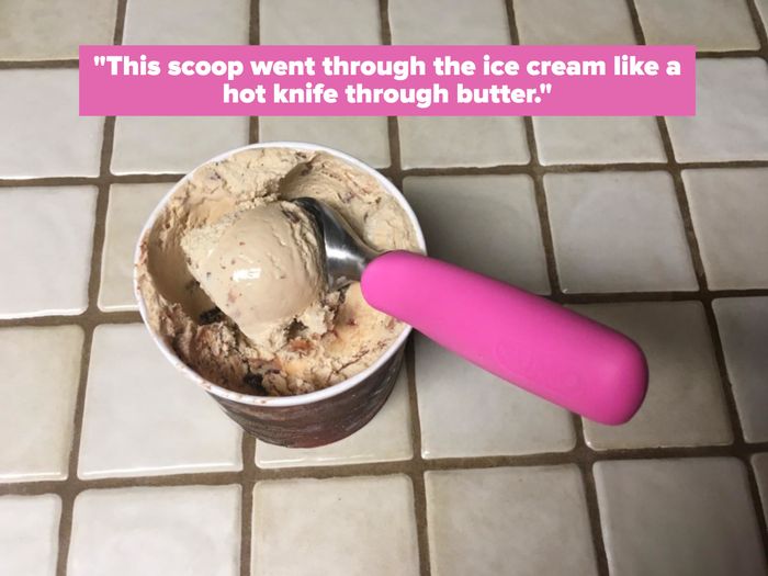 The pink scoop effortlessly gliding through ice cream, accompanied by a reviewer's note: 'This scoop cut through ice cream like a hot knife through butter.'