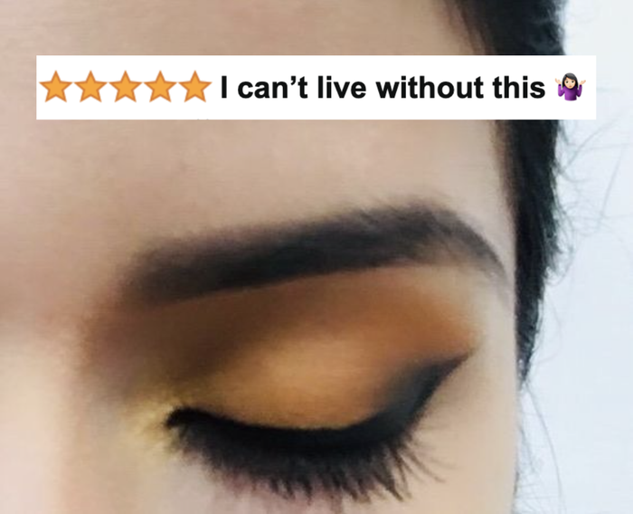 A reviewer’s close-up photo of a winged black liquid eyeliner with a five-star caption:
