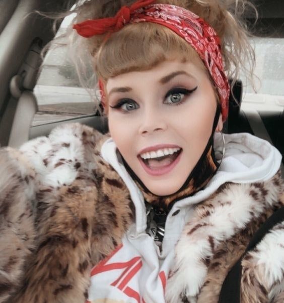 A reviewer showcasing bold, thick-winged eyeliner.