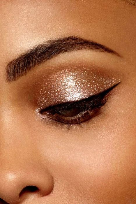 model showcasing golden glitter