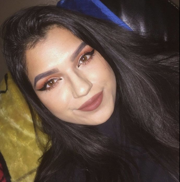 A reviewer showcasing a bold black liquid eyeliner look