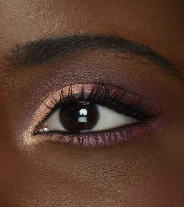 model showcasing eyeshadow looks created with the palette