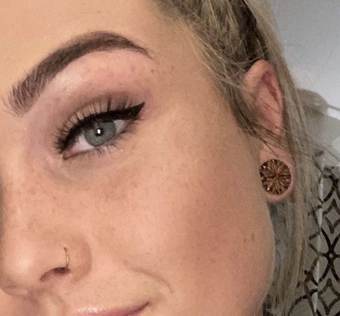 A close-up photo of a reviewer wearing black liquid eyeliner.