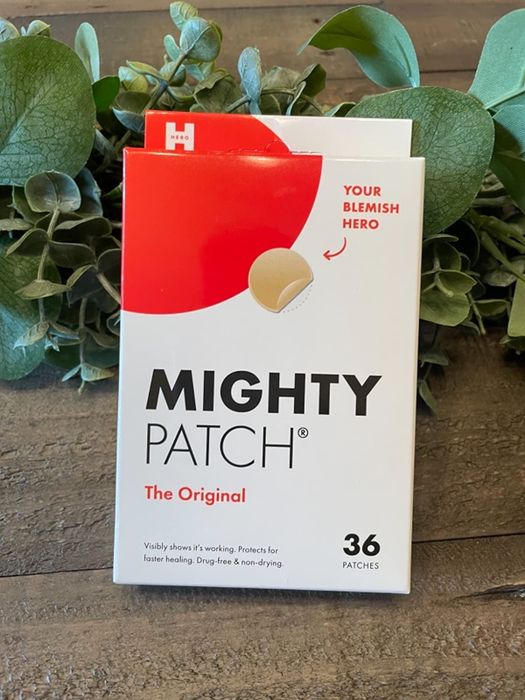 Reviewer’s photo showcasing the red and white packaging of the pimple patches.
