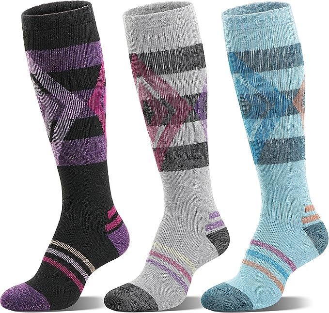 Three pairs of knee-high socks featuring bold geometric patterns
