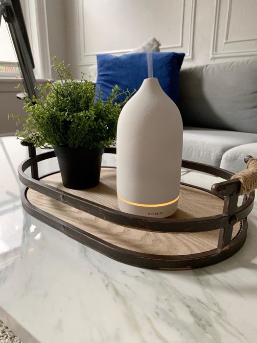 The white stone diffuser placed on a coffee table