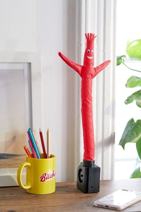 small inflatable character waving