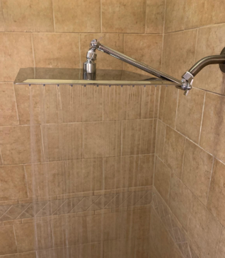 Reviewer image showing the showerhead with water cascading like rain