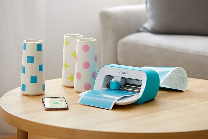 A compact blue Cricut Joy machine
