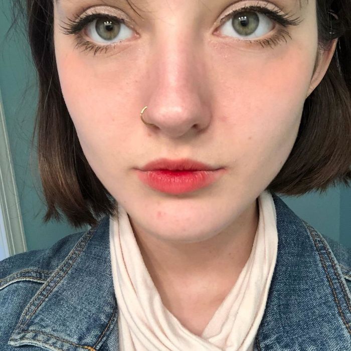 A reviewer rocking the lip tint for a fresh look