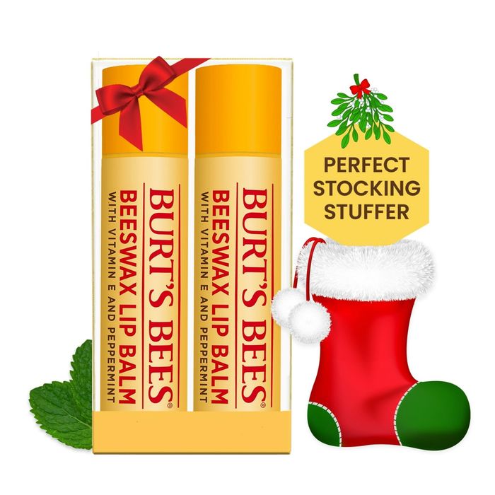 Two Burt's Bees lip balms infused with vitamin E and peppermint, the perfect stocking stuffer for the holiday season, accompanied by a charming Christmas stocking graphic.