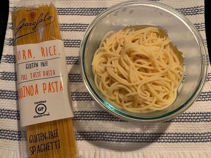 A reviewer's bowl filled with freshly prepared pasta.