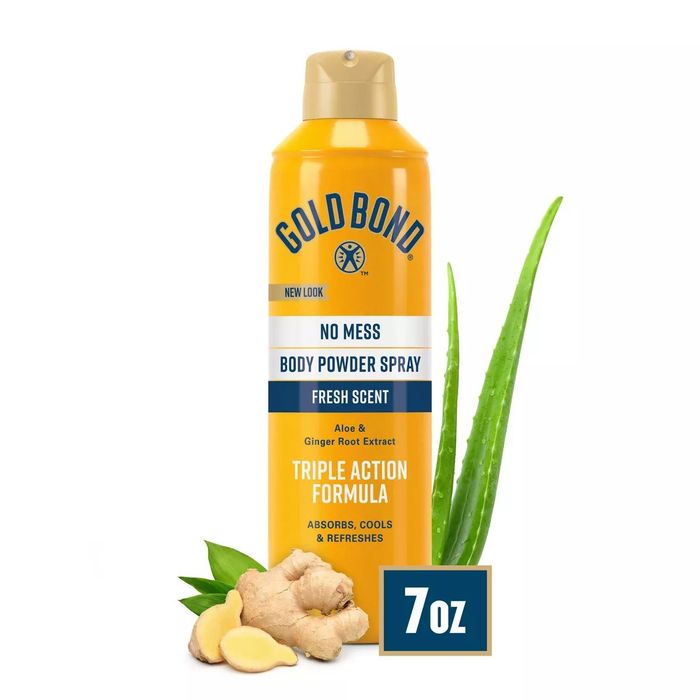 A can of Cold Bond body powder spray, infused with aloe and ginger root extract. The product highlights include being no-mess, having a fresh scent, and a triple-action formula. 7oz.