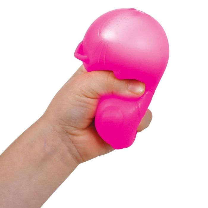 A hand holding a pink stress ball in the shape of a cat