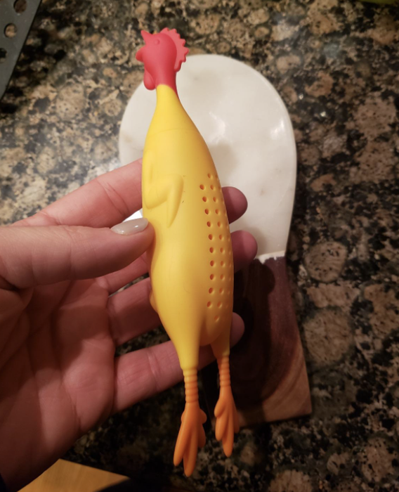 A photo of the chicken herb infuser held by a reviewer