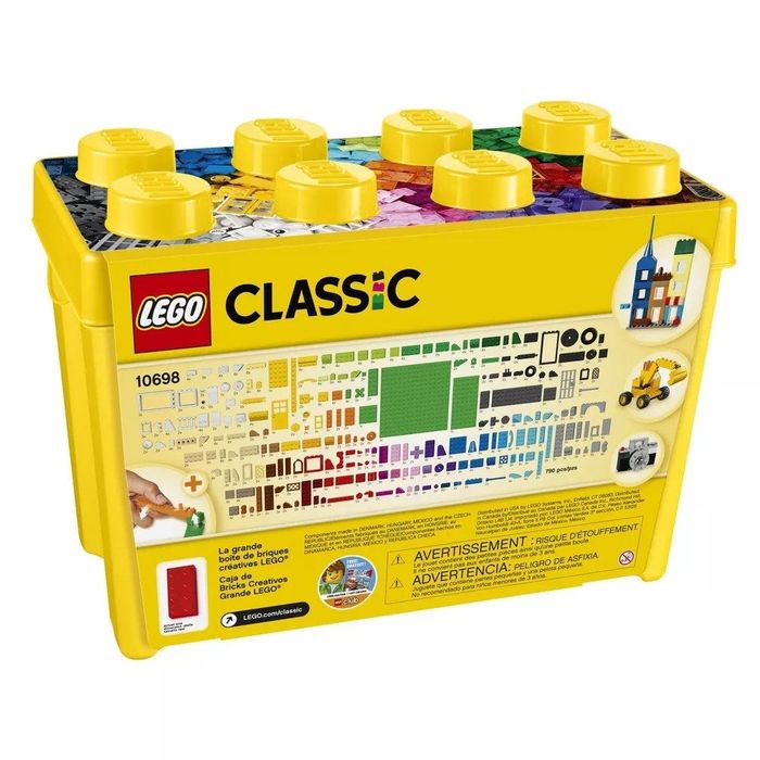 A yellow plastic bin containing an assortment of Lego pieces, all included and neatly organized.