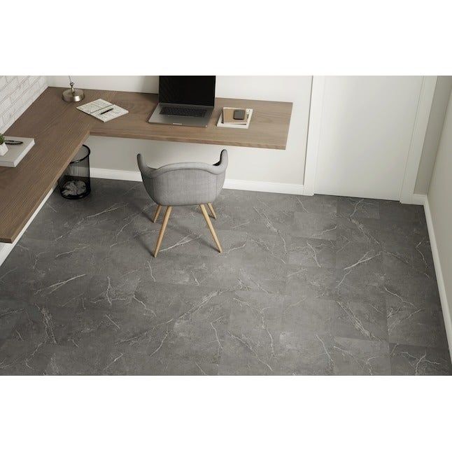 A sleek home office arrangement with a wooden desk, a gray chair, a laptop, and a well-organized workspace, complemented by modern marble-like flooring.