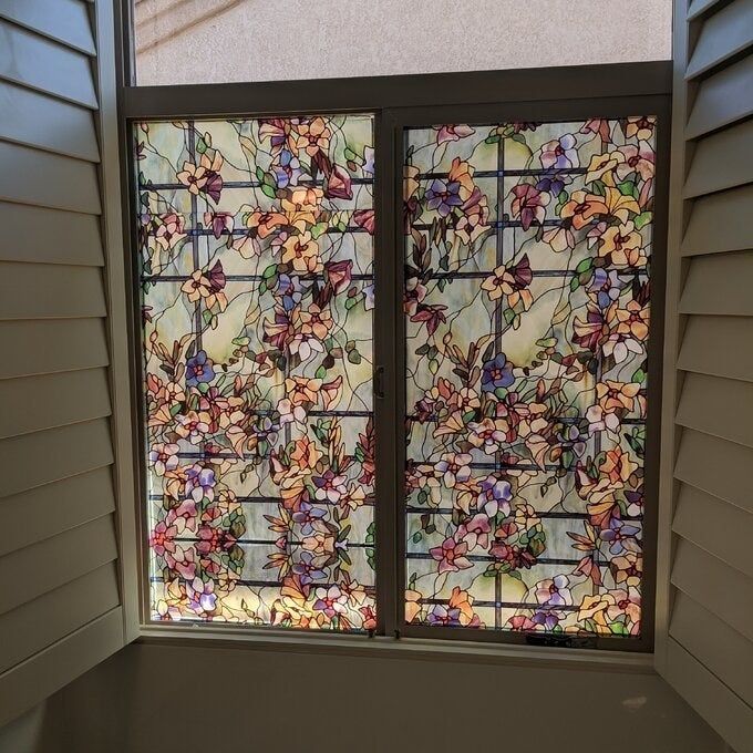 Reviewer photo showcasing the window film paired with shutters