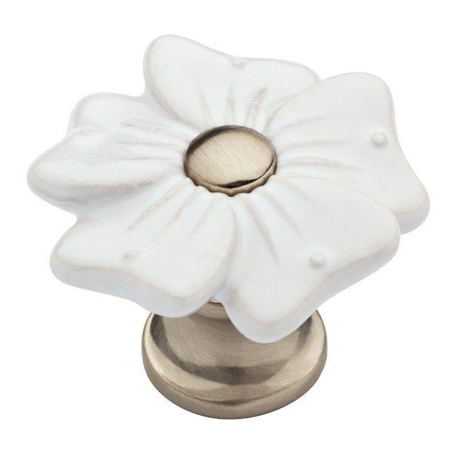 A floral-inspired knob featuring delicate white petals.