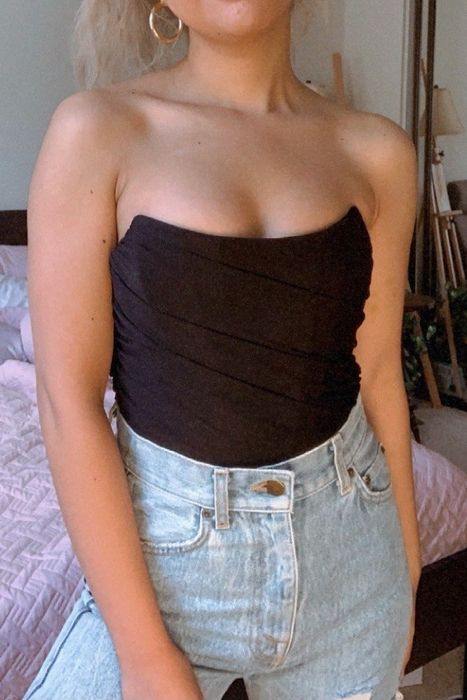 customer modeling the black bustier