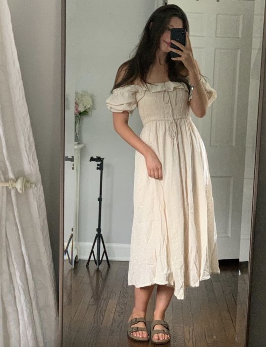 A reviewer wearing the dress.