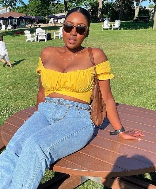 A reviewer wearing the yellow top