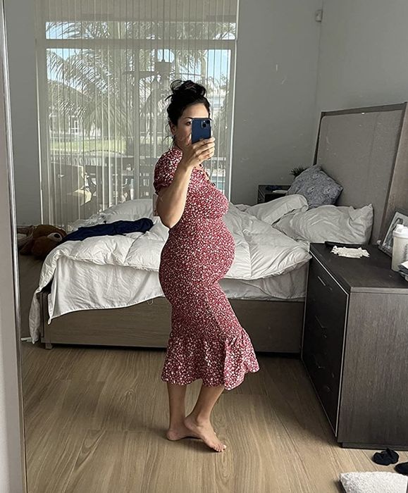 A reviewer wearing the dress.