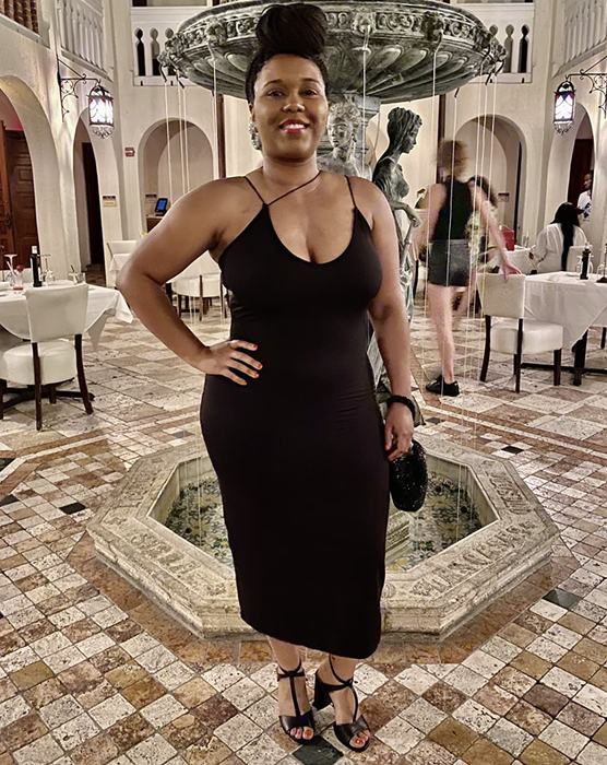 customer wearing the black dress