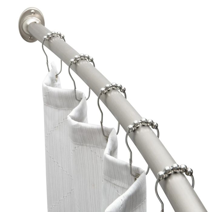 A silver curved shower curtain rod.