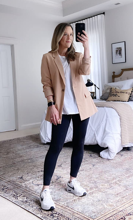 Image of a reviewer donning a tan blazer