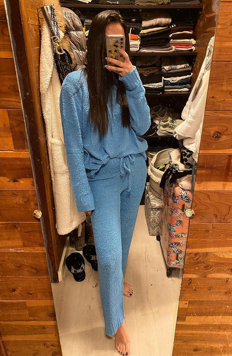 A reviewer wearing the blue version of the lounge set