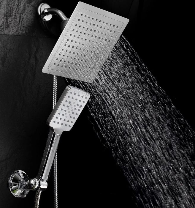 A square waterfall showerhead paired with a small handheld showerhead for versatile bathing options.