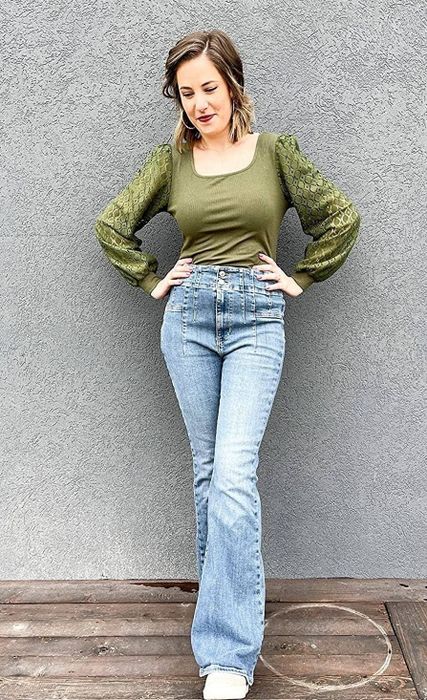 Reviewer modeling the green shirt