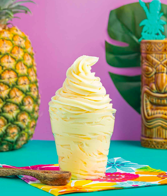 A refreshing Dole Whip treat served in a clear cup.