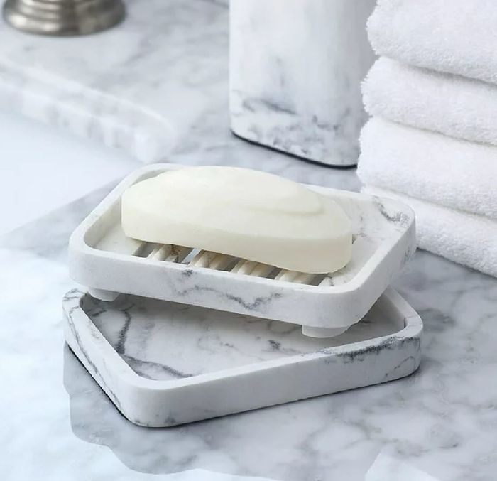 Two elegant marble soap dishes.