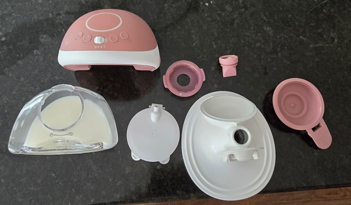 Includes essential components like the base unit, flange, and feeding bottle