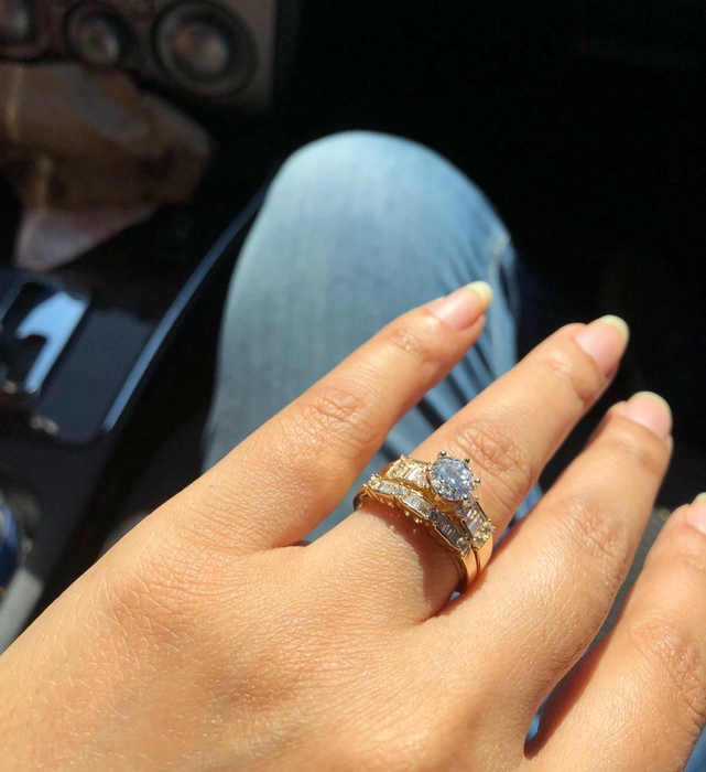 A reviewer showcasing the ring set