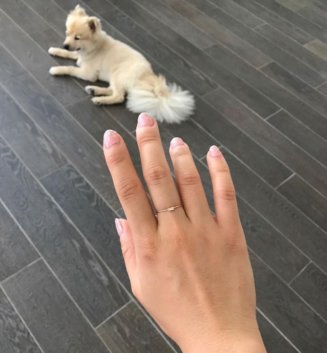 another reviewer proudly displaying the same delicate ring