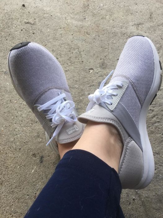 Reviewer in white sneakers