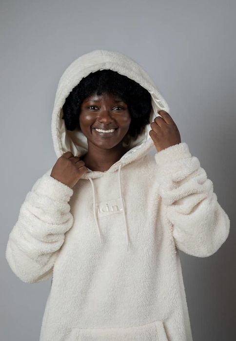 A model is seen wearing a cozy sweater.